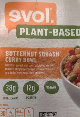 BUTTERNUT SQUASH CURRY WITH PEAS, CHICKPEAS, RED BELL PEPPERS, AND JALAPENO PEPPERS IN A CURRY SAUCE, ON A BED OF RICED CAULIFLOWER AND LENTILS BOWL, BUTTERNUT SQUASH CURRY