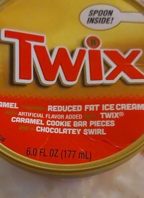 CARAMEL FLAVORED REDUCED FAT ICE CREAM WITH TWIX CARAMEL COOKIE BAR PIECES AND A CHOCOLATELY SWIRL, CARAMEL