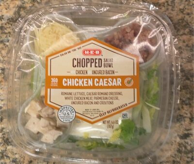 CHICKEN CAESAR ROMAINE LETTUCE, CAESAR ROMANO DRESSING, WHITE CHICKEN MEAT, PARMESAN CHEESE, UNCURED BACON AND CROUTONS CHOPPED SALAD BOWL, CHICKEN CAESAR
